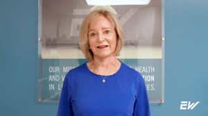 A woman describing her positive experience taking Pilates classes at EW Motion Therapy