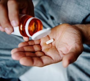 Prescription medication being taken for pain or treatment.