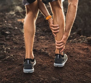 Runner experiencing calf pain.