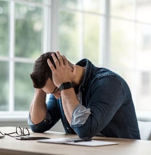 Man suffering from tension headache and upper body stress.