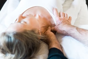 Hands-on treatment addressing neck tension.