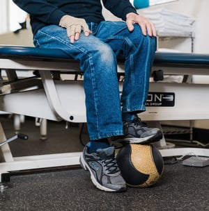 Patient performing a foot and ankle exercise during physical therapy.