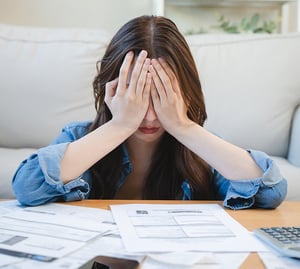 Person showing signs of stress and headache.