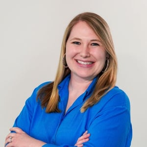 EW Motion Therapy Provider Liaison Alysssa Gibson poses smiling for a headshot, wearing a blue collared top.