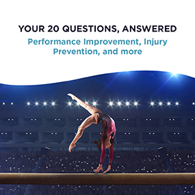 Gymnast executing a back walkover on the balance beam under arena lights, representing EW Motion Therapy's free gymnastics guide on performance improvement and injury prevention