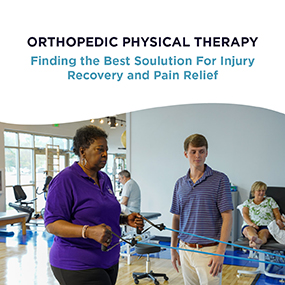 Physical therapist in a purple shirt guiding a patient through a resistance band exercise in a bright orthopedic PT clinic, representing EW Motion Therapy's guide to injury recovery and pain relief
