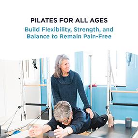 Pilates instructor guiding an older adult through a reformer stretch in a bright studio, representing EW Motion Therapy's guide to building flexibility, strength, and balance through Pilates at any age