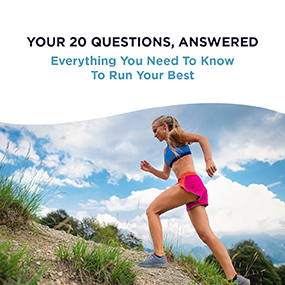 Woman in athletic gear running uphill on a trail under a blue sky, representing EW Motion Therapy's free running guide on everything you need to know to run your best